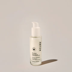 A bottle of Bonding Hair Serum with a pump dispenser, predominantly white in color with simple labeling.