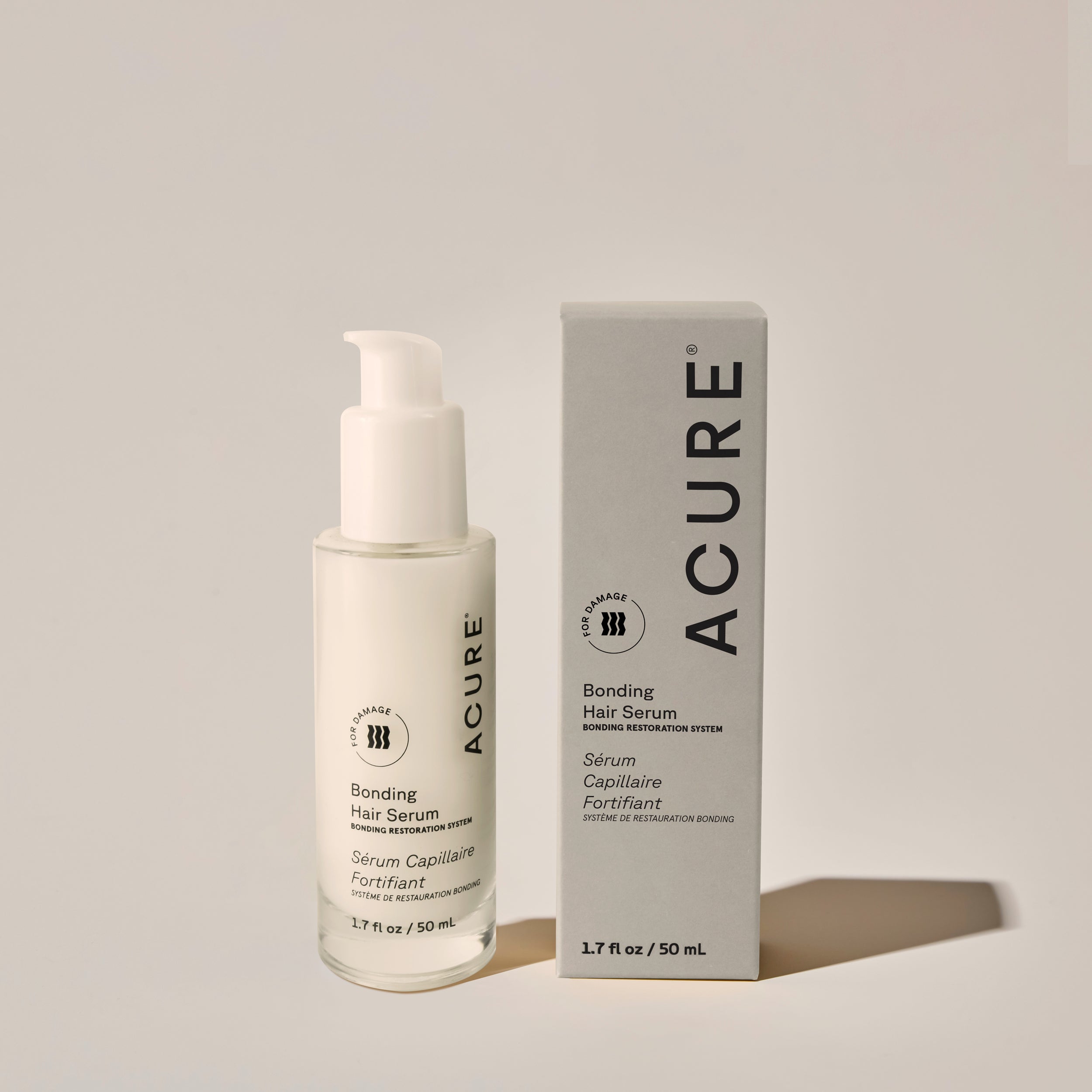 ACURE Bonding Hair Serum bottle with pump dispenser next to its box - Strengthening & Smoothing Leave-In Treatment- next