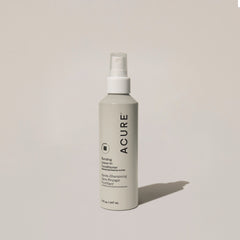 A bottle of ACURE Bonding Leave-In Conditioner spray on a neutral background.