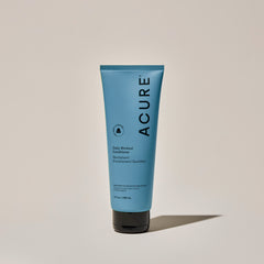A tube of ACURE Daily Workout Conditioner against a neutral background.