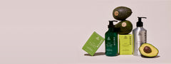 Avocado and skincare products on a beige background