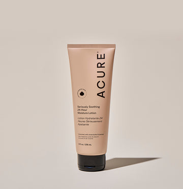 A tube of ACURE brand Seriously Soothing 24hr Moisture Lotion against a neutral background.