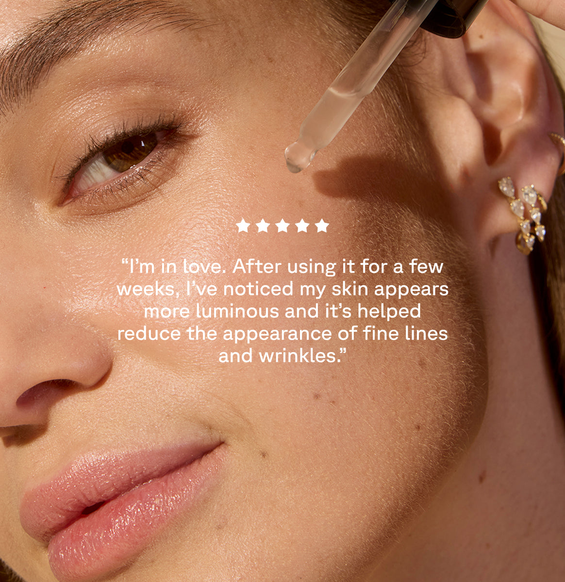 Woman applying Serum with a dropper on her cheek on the background with text on top: A customer review: