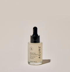 A clear glass dropper bottle of ACURE Zombie Cell Clarifying Serum against a neutral background.