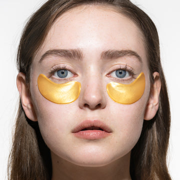 Woman using Acure Under eye hydrogels