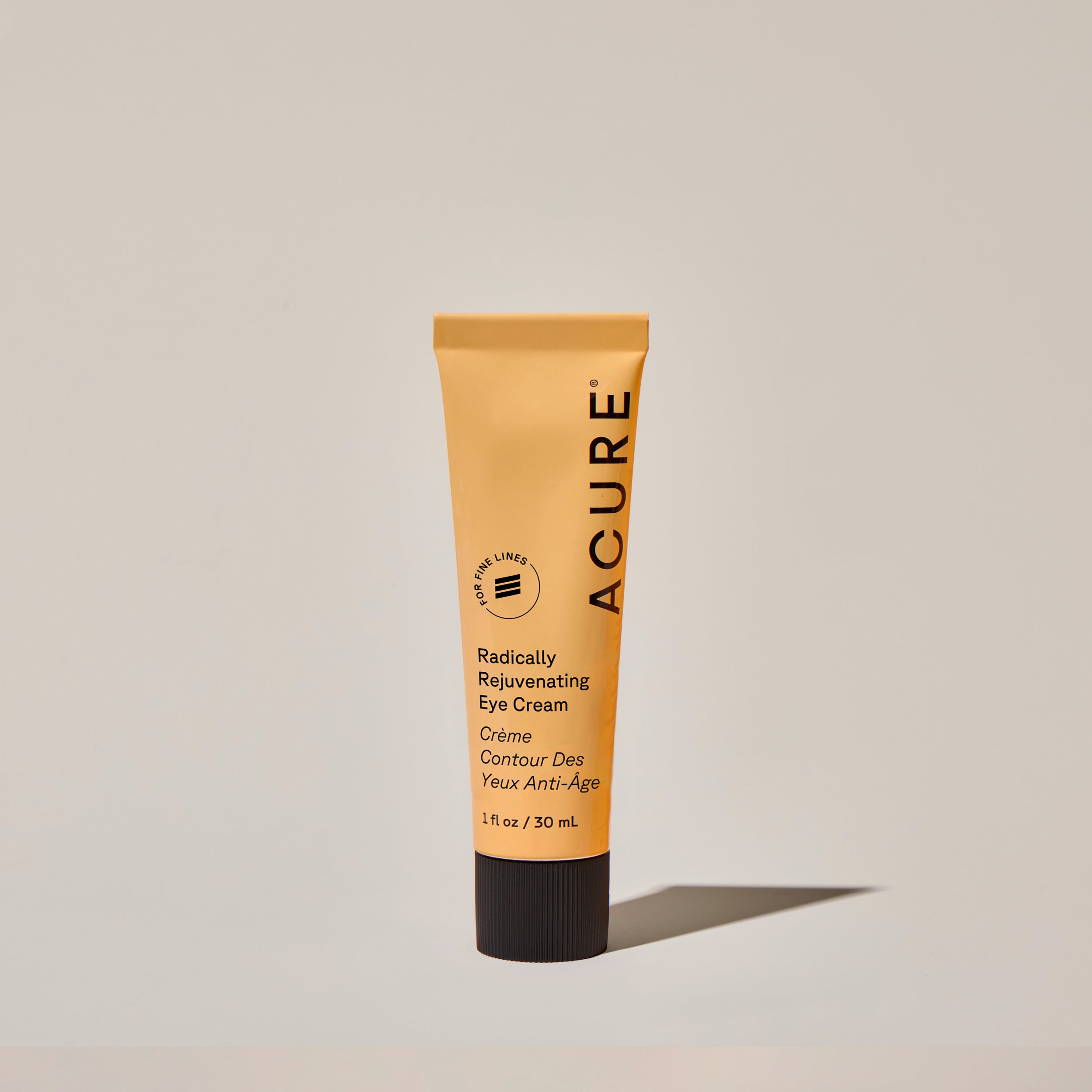 A tube of ACURE Radically Rejuvenating Eye Cream against a neutral background.