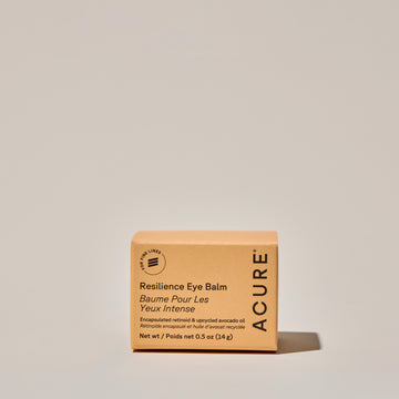 Glass Jar of Acure Resilience Eye Balme box on a neutral background