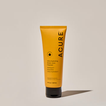 A tube of ACURE Ultra Hydrating Green Juice Cleanser against a neutral background.