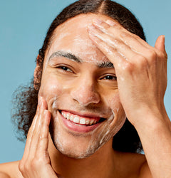 Man applying face cleanser for a healthy non-toxic skincare routine
