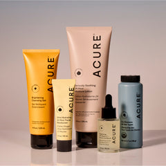 Acure skincare products including gel, lotion, serum, and shampoo on a gradient background