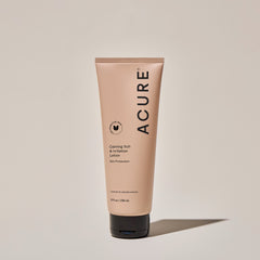 A tube of ACURE Calming Itch & Irritation Lotion against a neutral background.