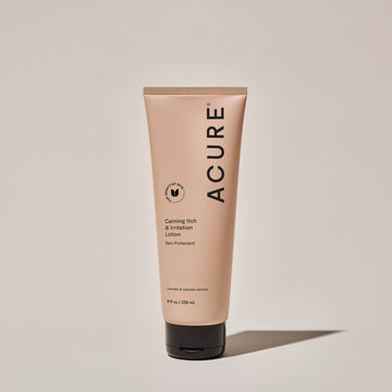 A tube of ACURE Calming Itch & Irritation Lotion against a neutral background.