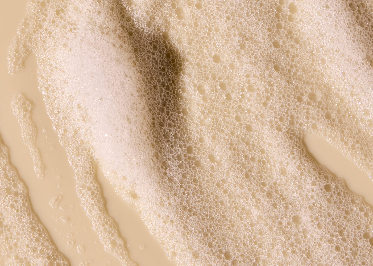 CLose-up of white cream on a white background with bubbles
