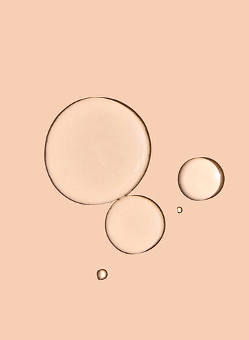 Three bubbles on a peach-colored background