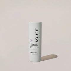 A white cylindrical container of ACURE Magnesium Deodorant with lavender and coconut, featuring product information and branding.