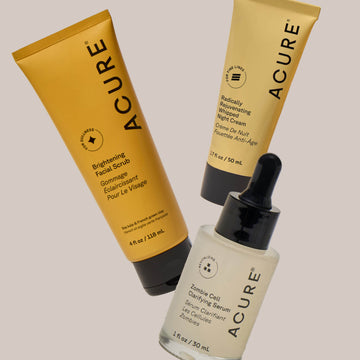 Three Acure skincare products on a light gray background