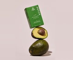 Avocado and Acure soap bar on a light pink background