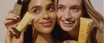 Close-up view of 2 women holding Acure's vegan skinccare products focusing on glowing, healthym hydrated, smooth skin
