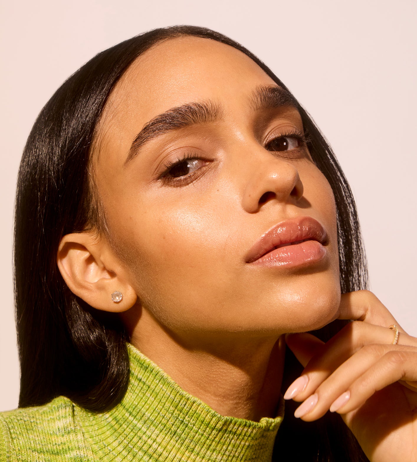 Woman close-up focusing on Even, glowing, hydrated skin thanks to Acure's skincare routines