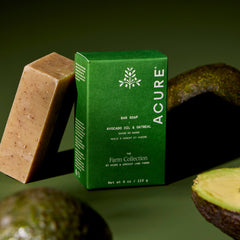 Acure bar soap with a green box on a green background