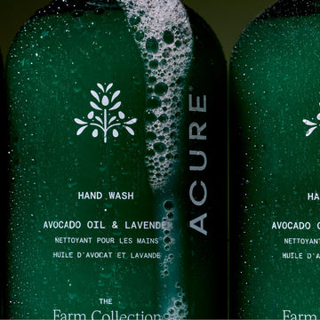 Green hand wash bottle labeled 'Acure' x Apricot Lane Farm with avocado oil and lavender ingredients.