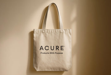Beige tote bag with 'ACURE' logo on a beige background