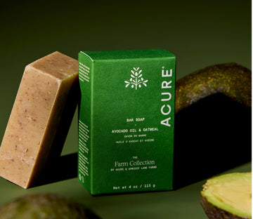Acure bar soap with a green box on a dark background