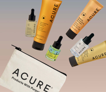 Collection of Acure skincare products including bottles and a pouch on a gradient background