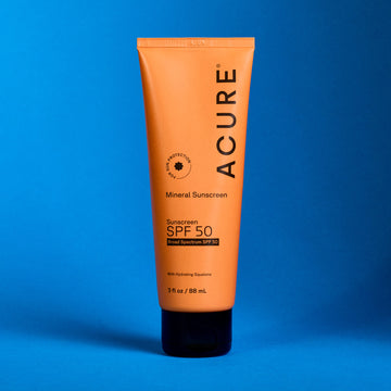 Mineral sunscreen 50 SPF tube on a blue background