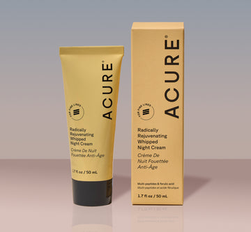 Acure Radically Rejuvenating Whipped Night Cream tube and packaging on a gradient background
