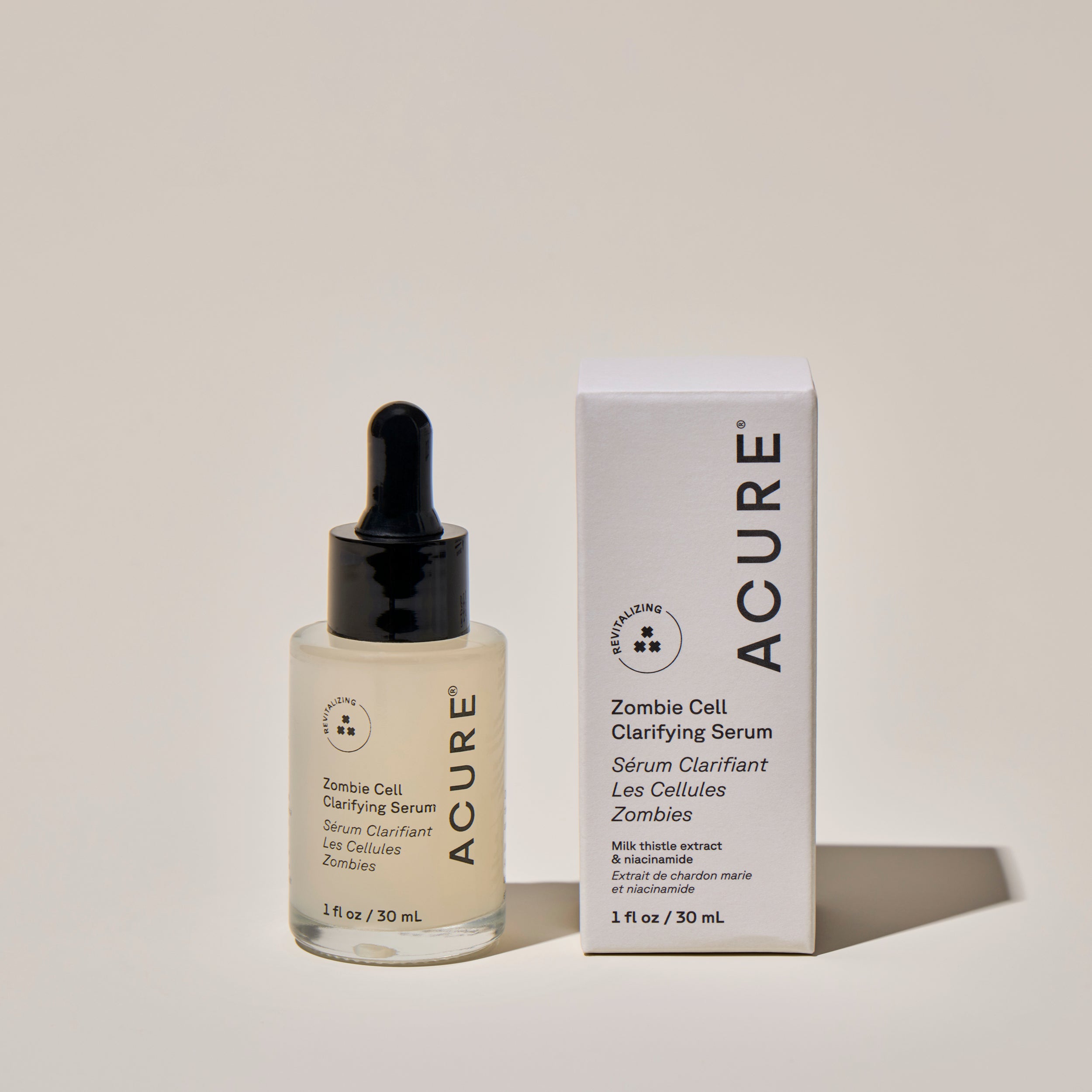 A clear glass bottle with a dropper containing Zombie Cell clarifying serum, labeled ACURE next to a the product box with the product details