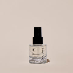 Acure skincare bottle on a beige background