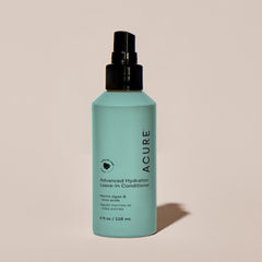 Acure Advanced Hydration Leave-In Conditioner bottle on a beige background