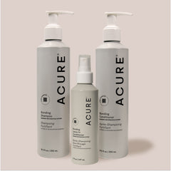 Acure hair care products including shampoo, conditioner, and spray on a light background