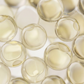 Close-up of clear capsules with a light background