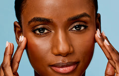 Close-up view of a womans face focusing on Skin Care Collection