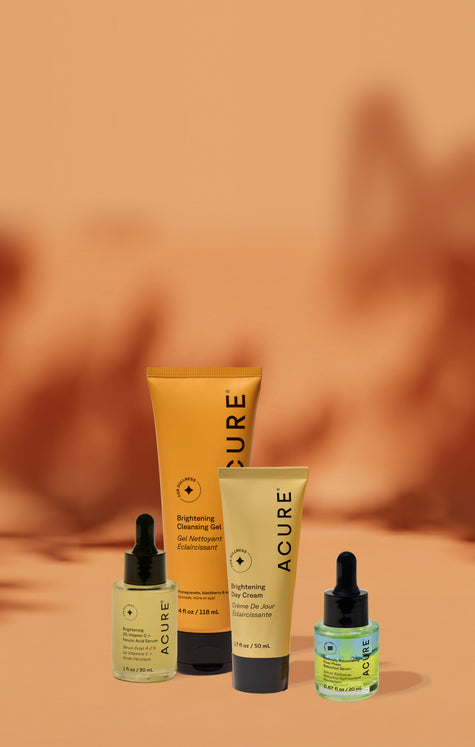Acure skincare products on a warm brown background image
