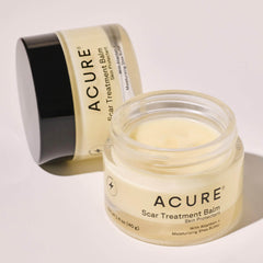 Acure Scar Treatment Balm jar on a light background