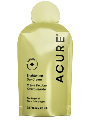 Acure Organics brightening day cream packaging on a white background