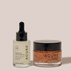 Acure skincare products including a serum and mask on a light background