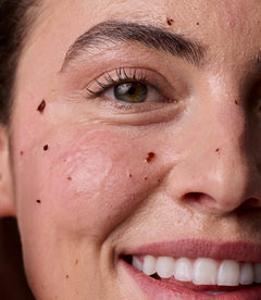 Close-up of a person's face with mask applied.